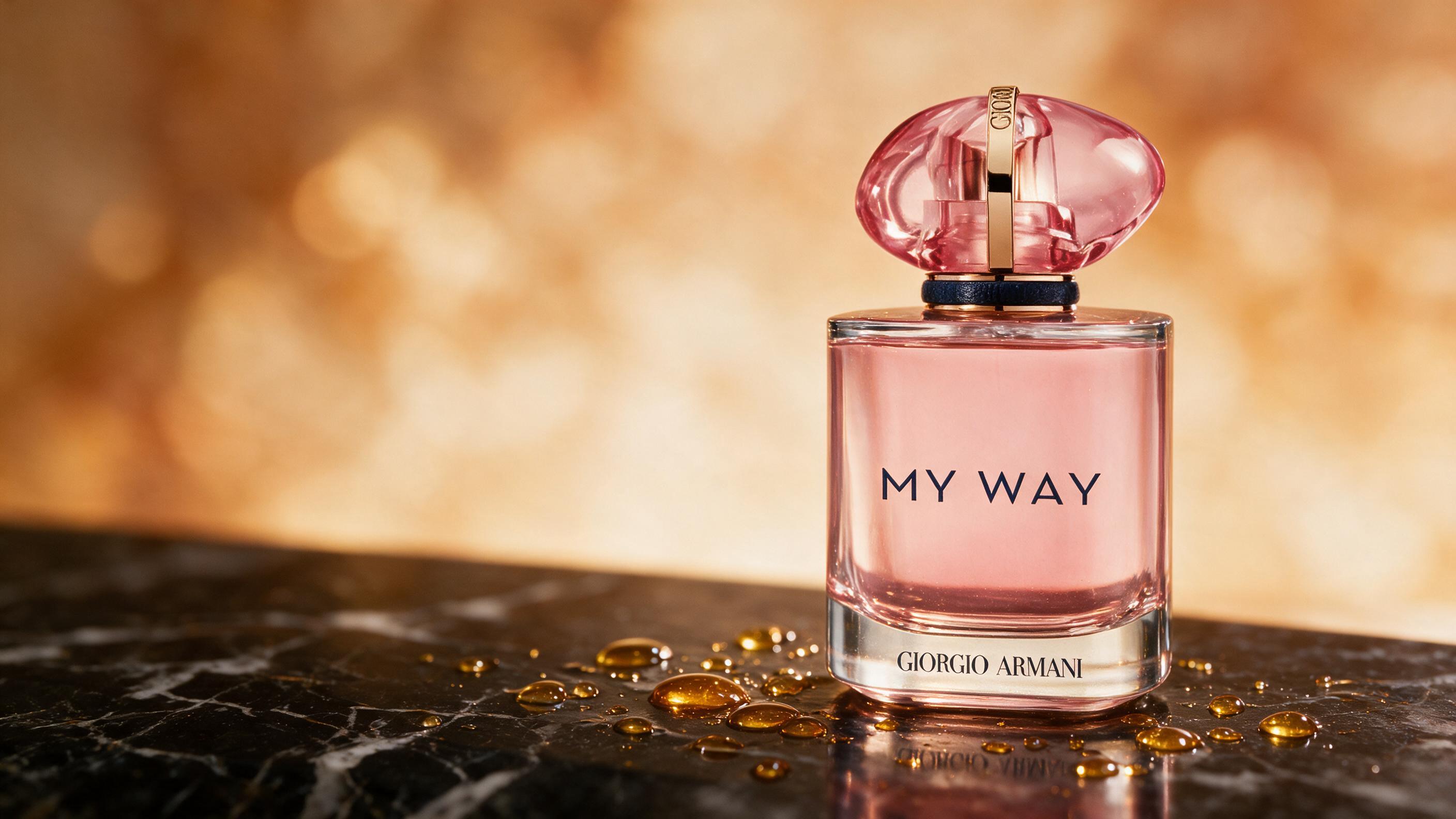 Elegant amber-brown glass perfume bottle labeled minimally, standing on a dark marble surface with warm honey-toned ligh