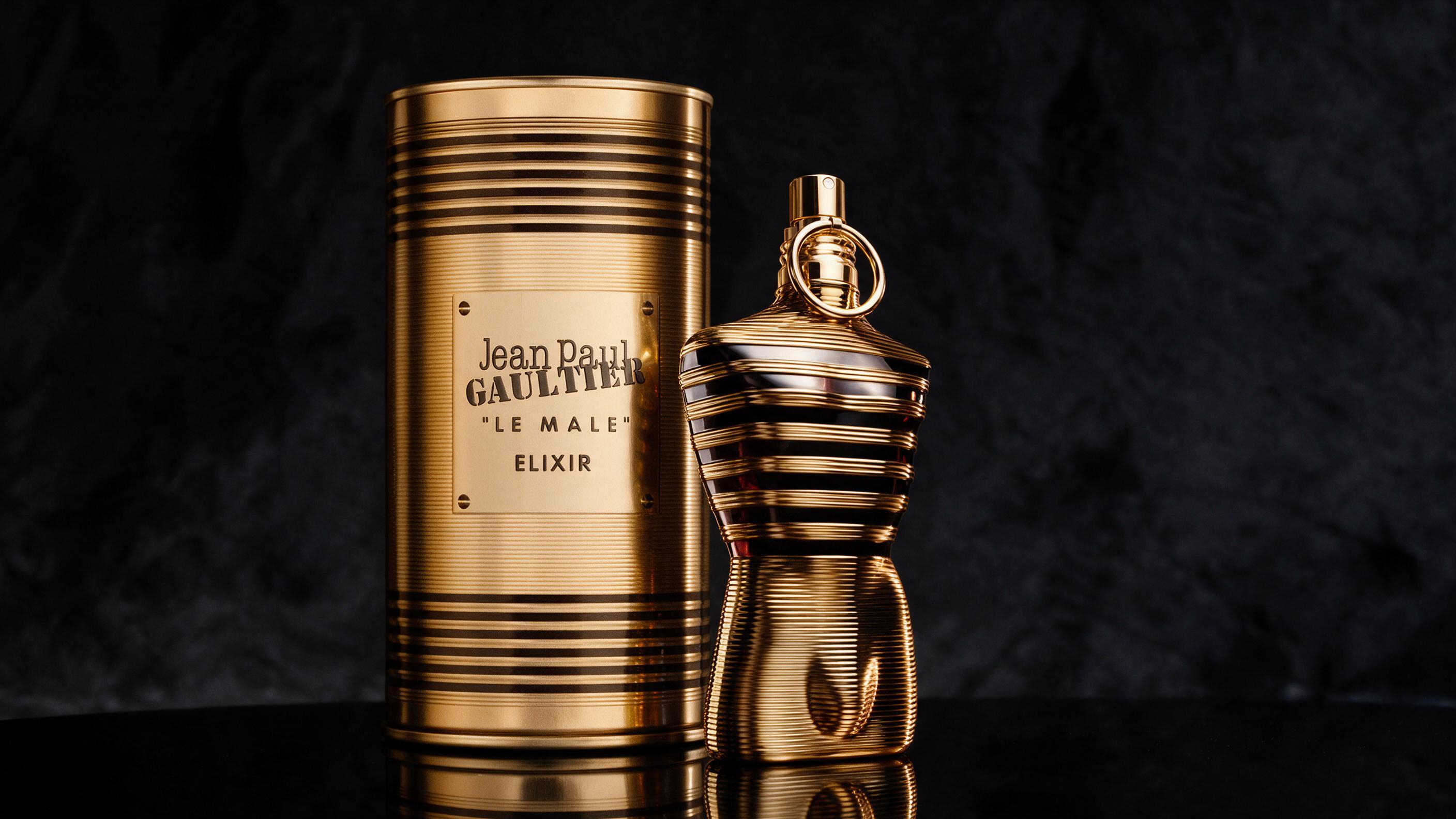 Photorealistic product photography of a dark navy perfume bottle with matte black cap, torso-shaped masculine fragrance