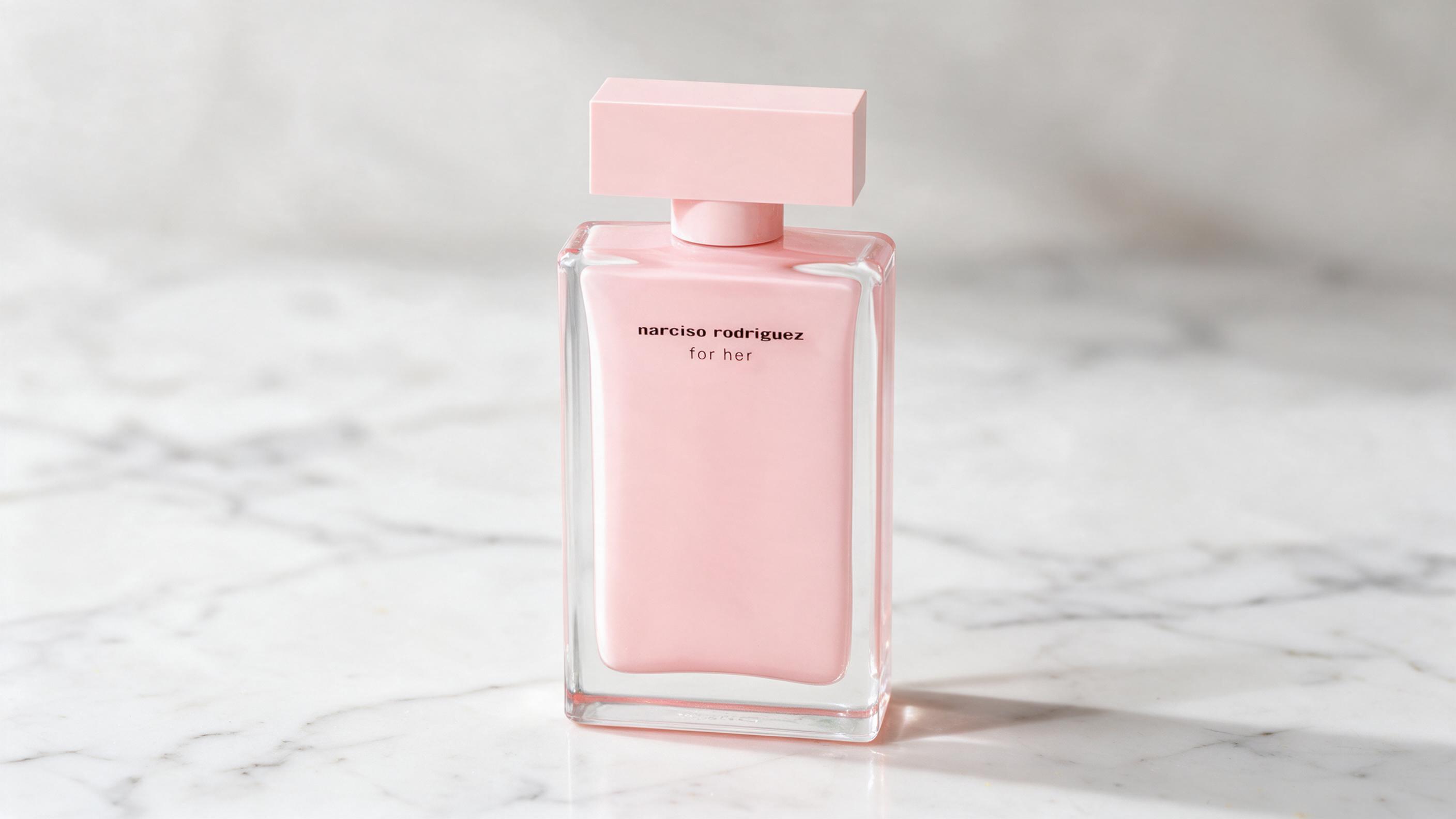 Elegant rectangular glass perfume bottle with transparent cap and pale golden liquid, tester style plain label, standing