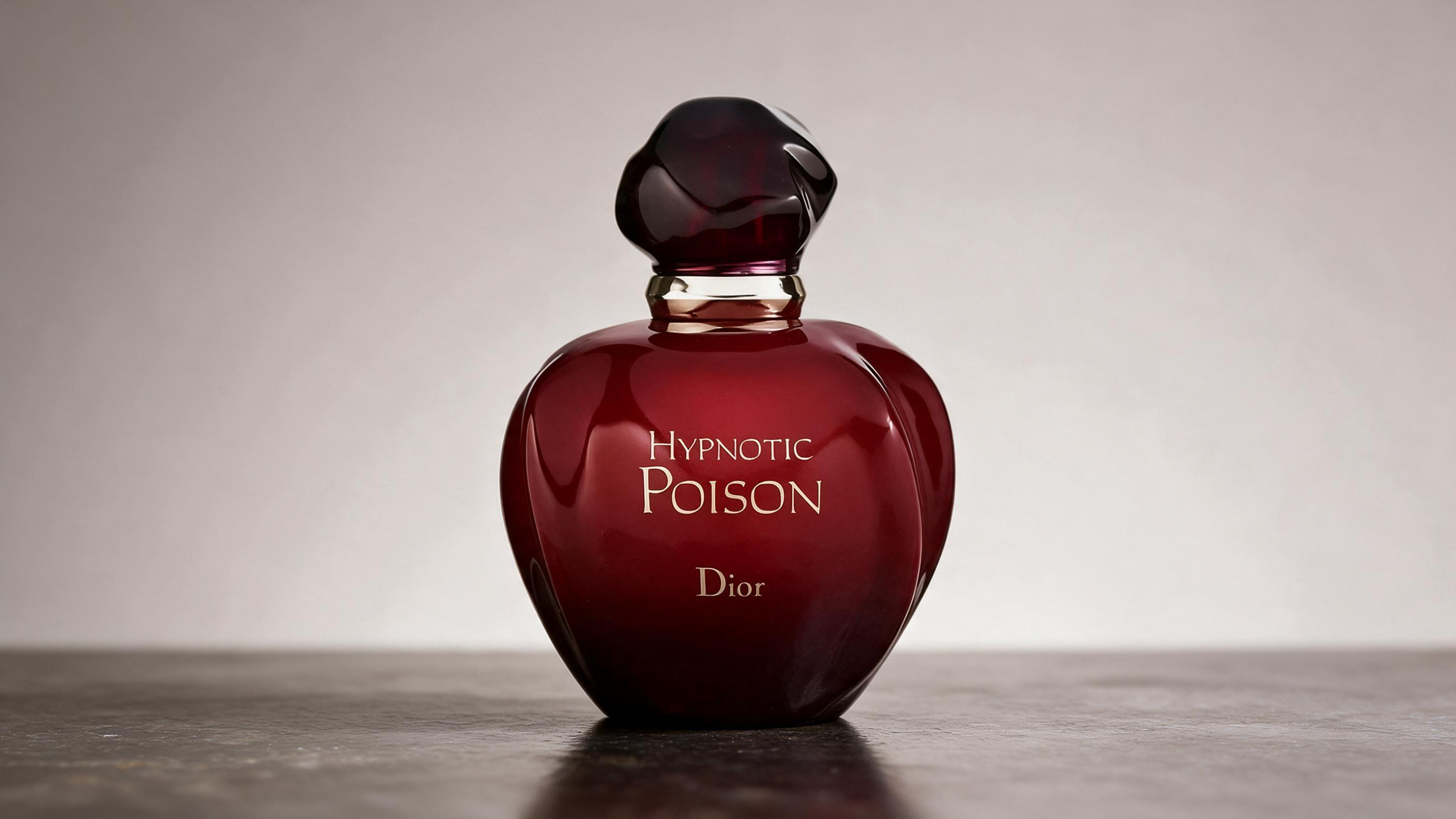 Elegant product photograph of a red opaque perfume bottle with a dark cap resting on a reflective surface, studio lighti