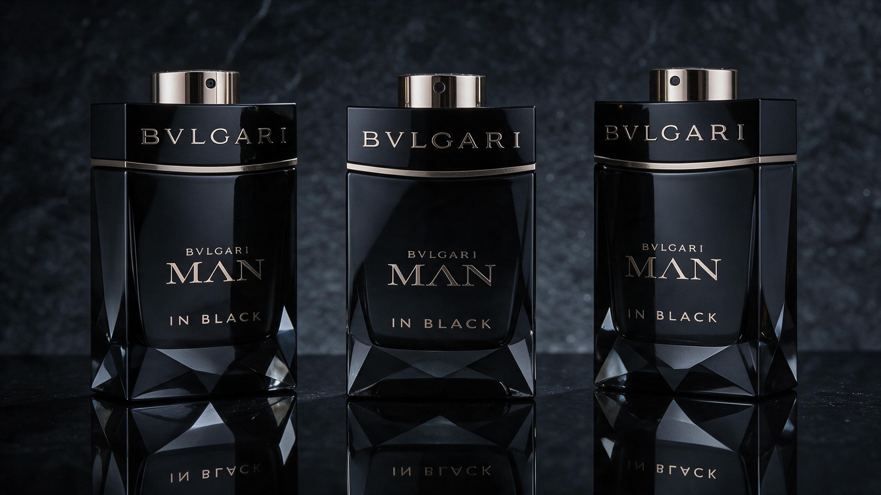 Three dark masculine perfume bottles with black faceted glass and sword-shaped silver caps, placed side by side on a ref