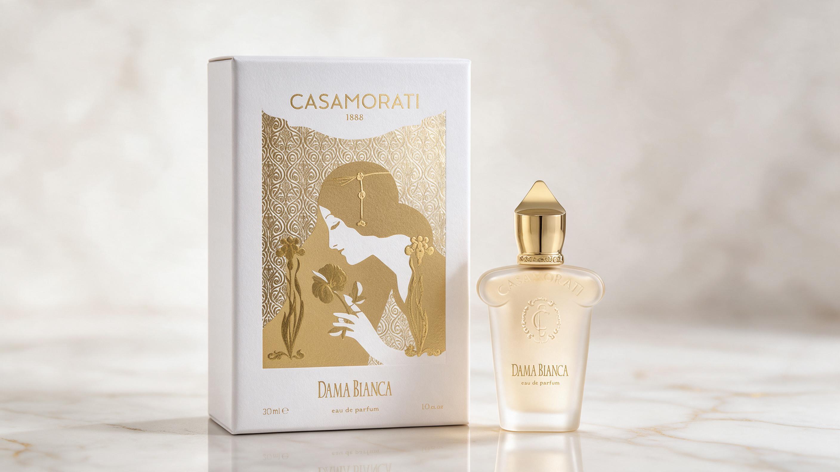 Elegant perfume bottle of a white-and-gold Italian niche fragrance, standing on a polished marble surface, soft diffused