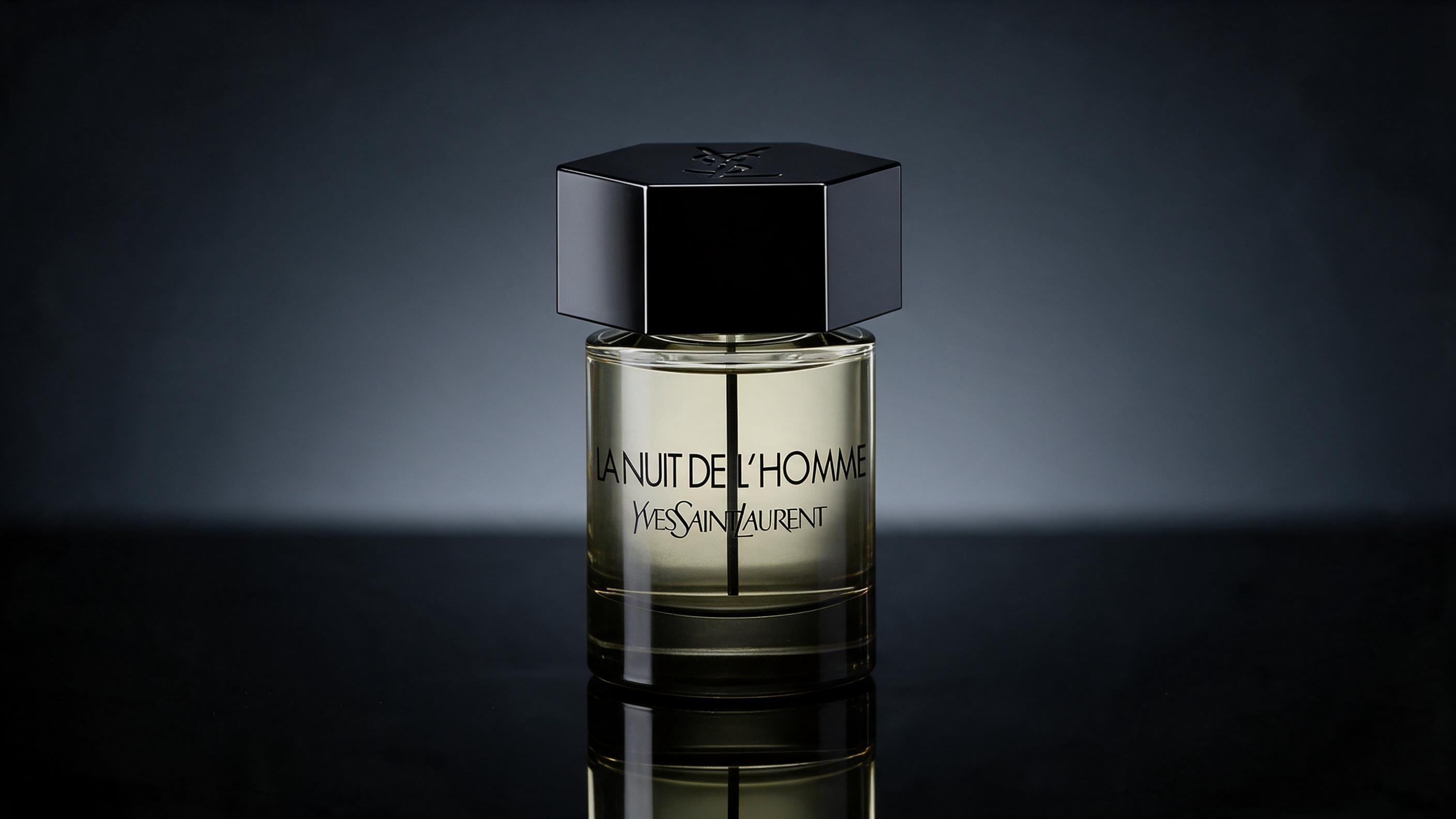 elegant black perfume bottle with silver cap, YSL L'Homme Nuit style masculine fragrance, standing on dark reflecti