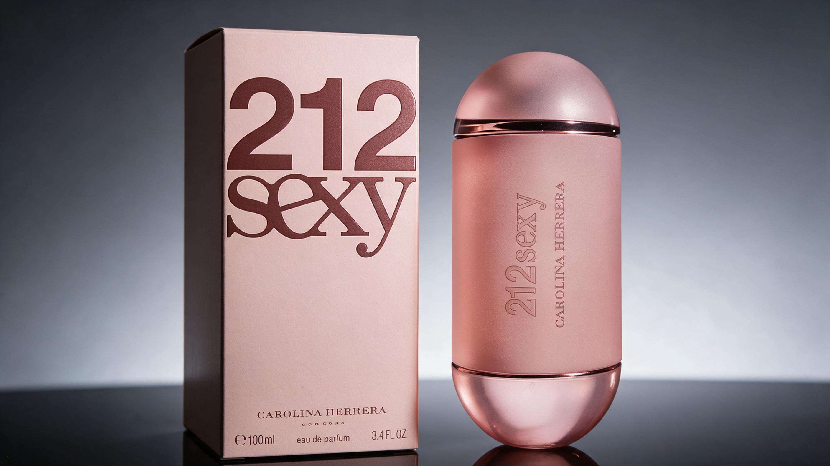 professional product photography of a cylindrical perfume bottle with golden cap and bold number print on the glass, pla