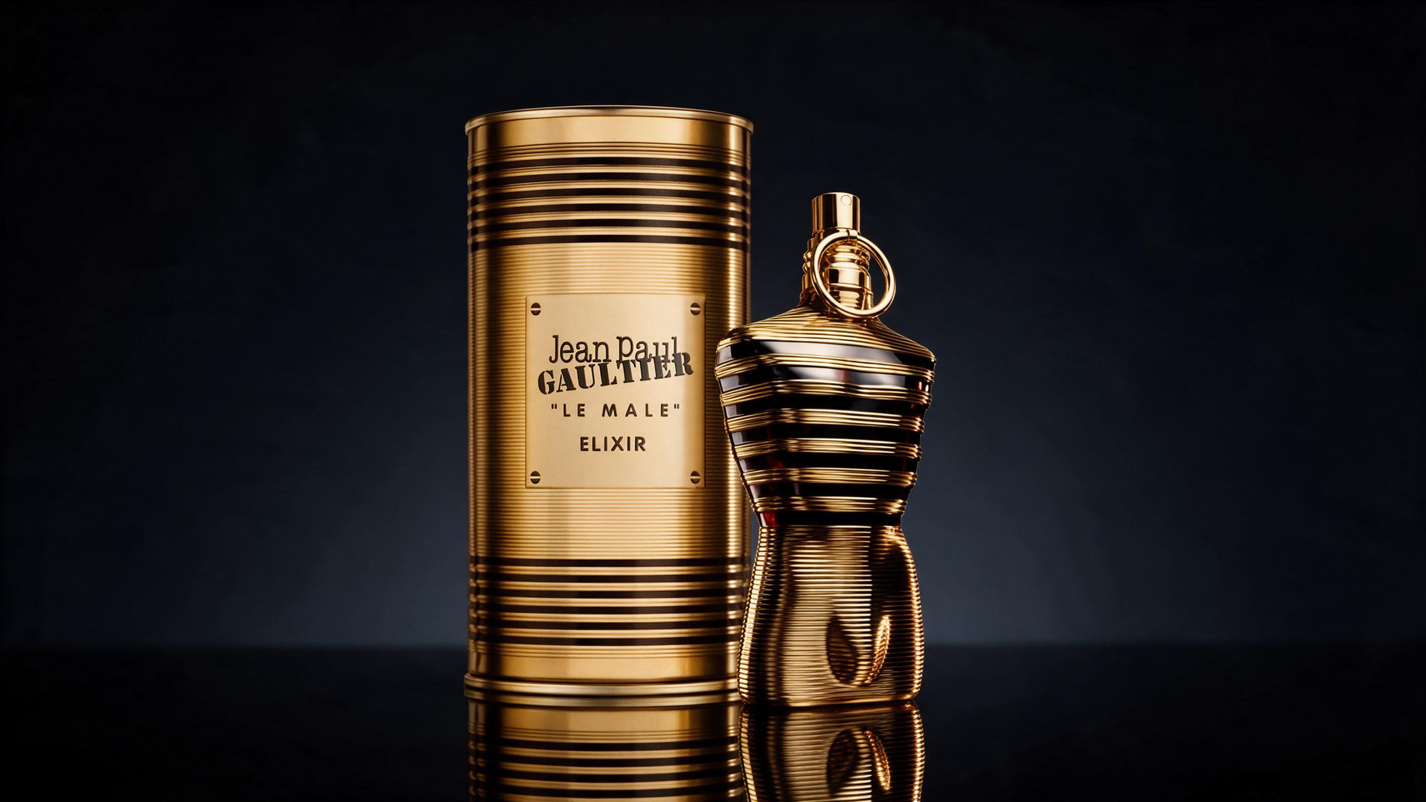 professional product photography of a dark angular masculine perfume bottle with a sailor-cap-shaped silver cap, standin